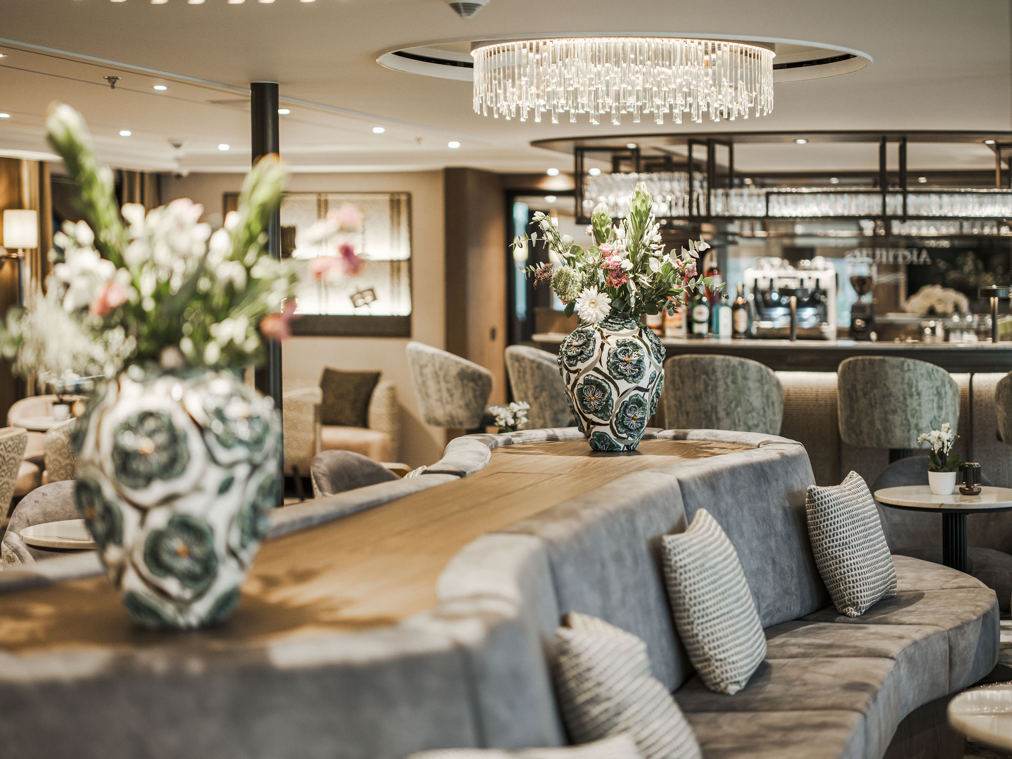 MS Serené lounge area with elegant seating, bar and modern interior design